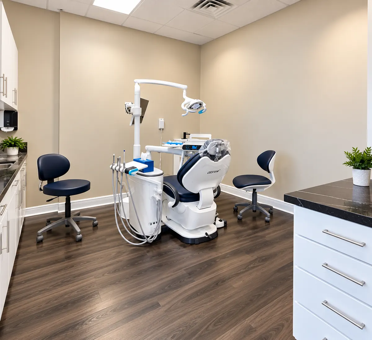 Bright treatment room with a modern dental chair and white cabinets